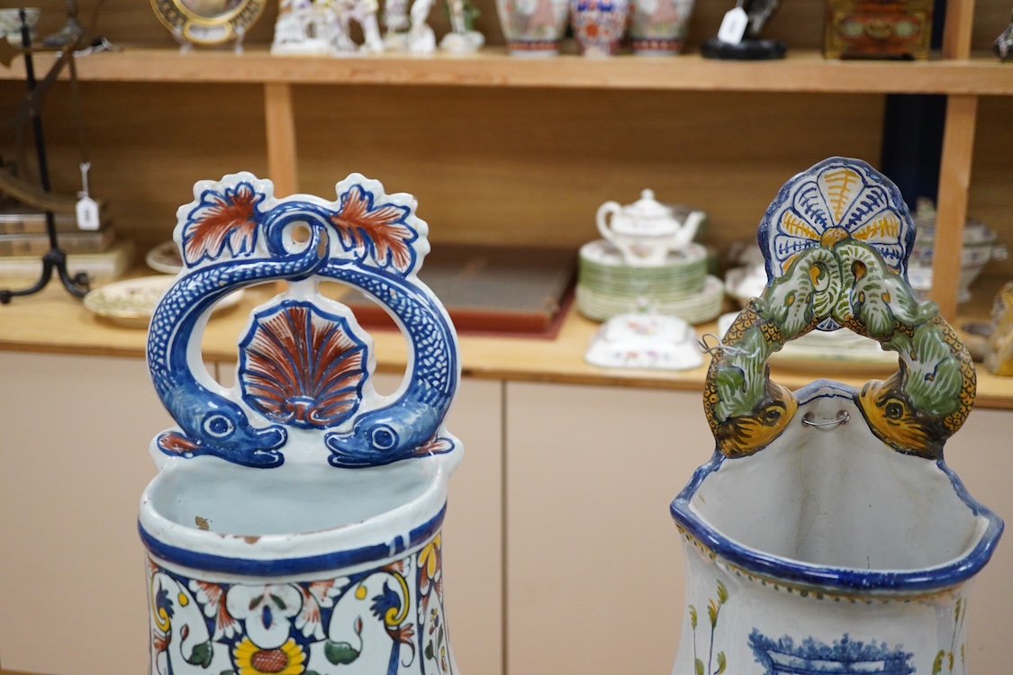 Two French faience large water wall cisterns, a wall pocket and wall bracket, largest 58cm high